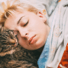 why does my cat sleep by my head?